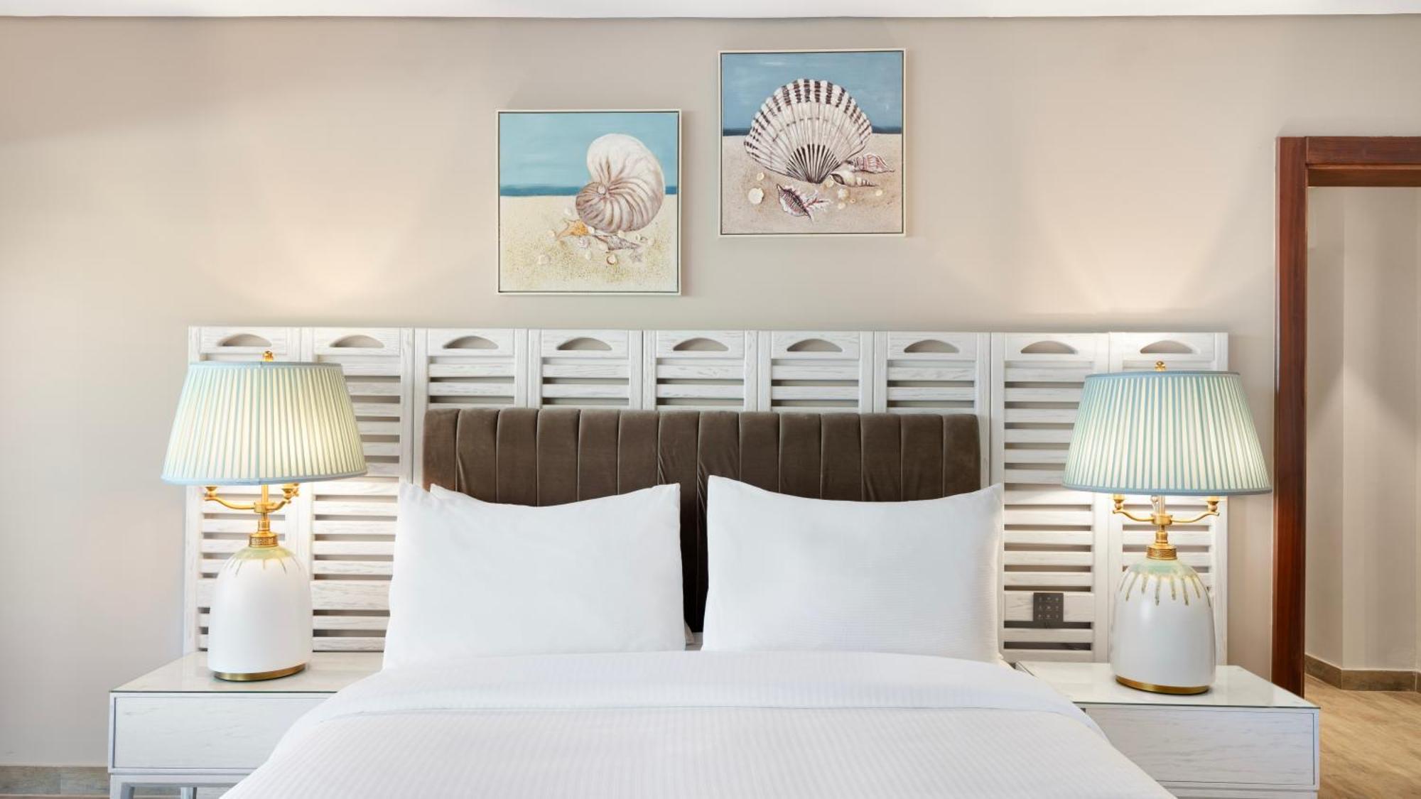 Rixos Premium Alamein El Alamein Camera foto A bedroom at Hilton Garden Inn